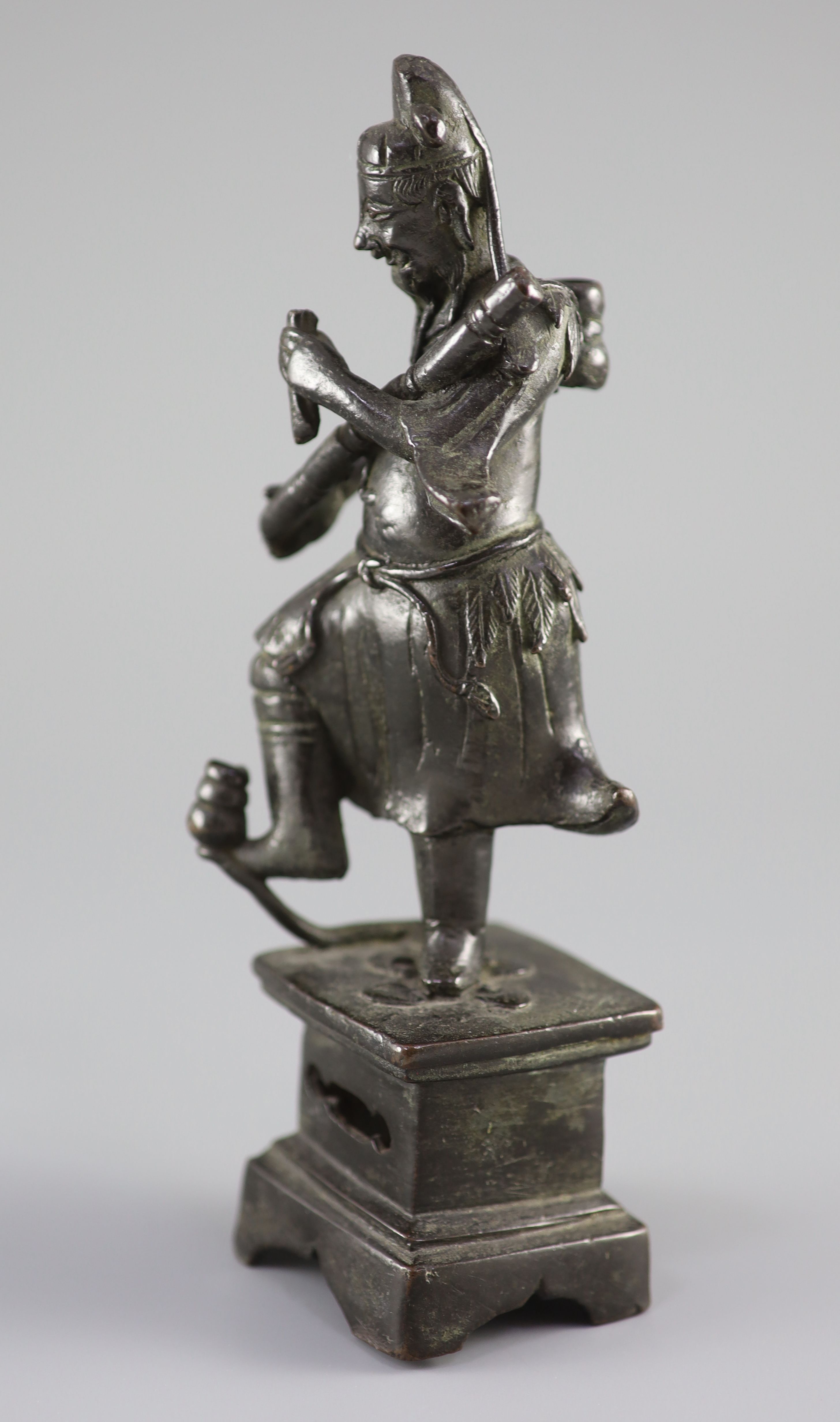 A Chinese bronze figure of an immortal, late Ming dynasty, 23 cm high